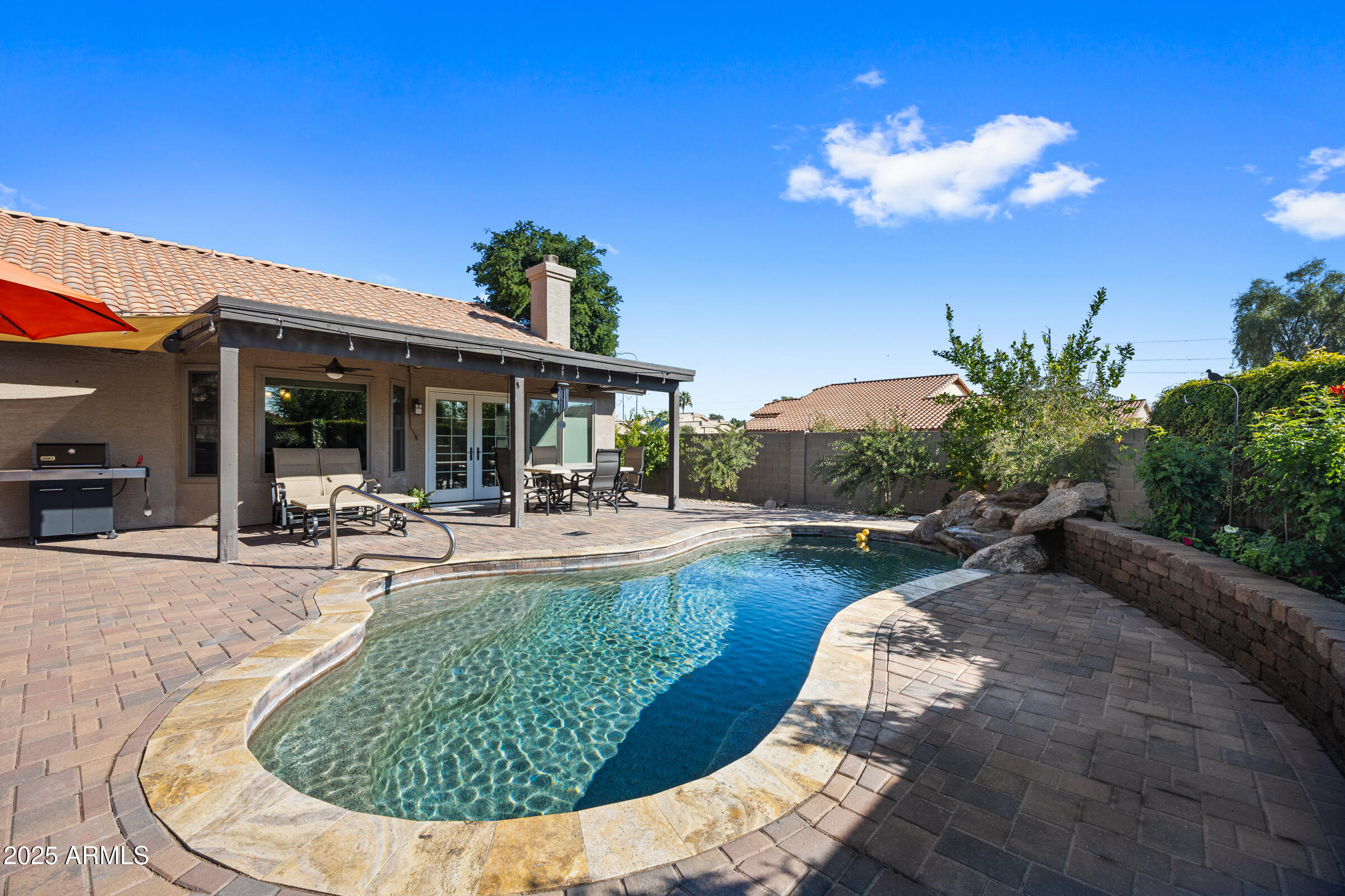 1111 West Lisa Lane Tempe, AZ 85284 - Photo 42 of 58 a view of a house with swimming pool and sitting area