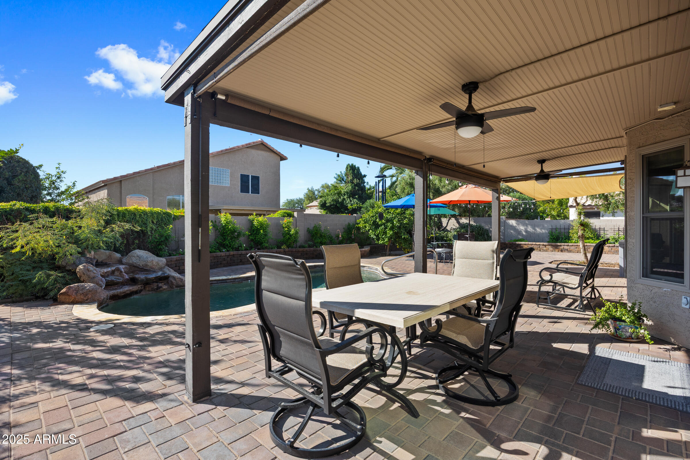 1111 West Lisa Lane Tempe, AZ 85284 - Photo 44 of 58 a view of a patio with a dining table and chairs