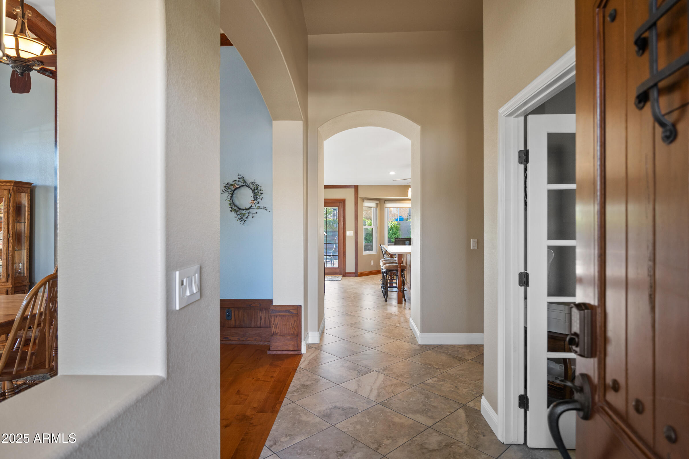 1111 West Lisa Lane Tempe, AZ 85284 - Photo 5 of 58 a view of a hallway with living room and a livingroom view