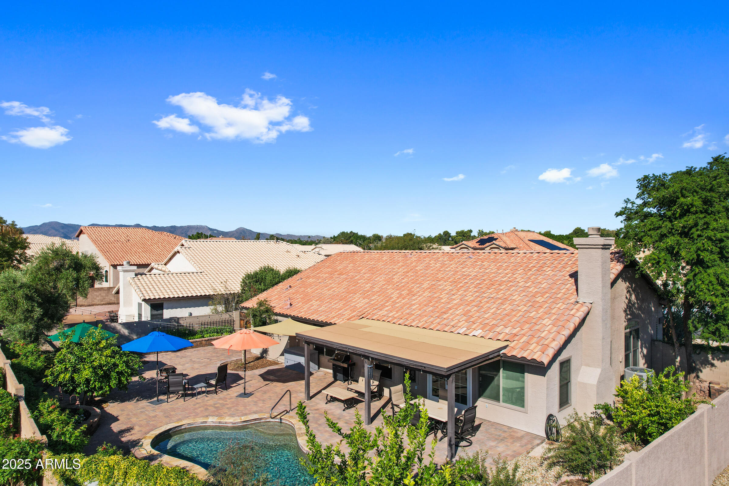 1111 West Lisa Lane Tempe, AZ 85284 - Photo 53 of 58 a roof deck with table and chairs and potted plants