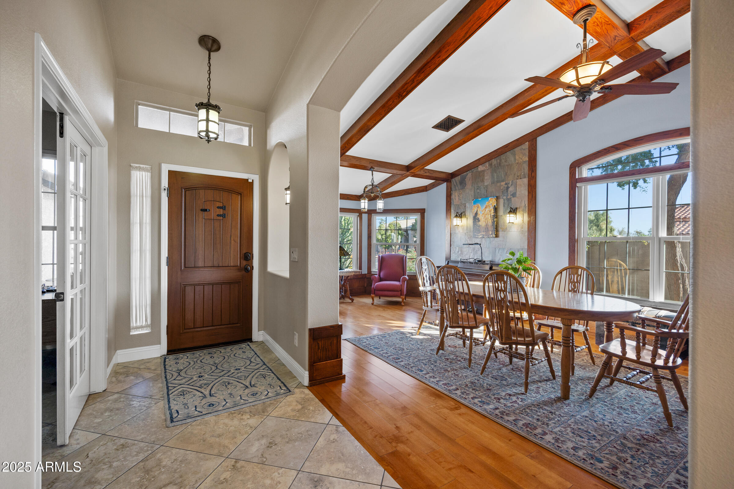 1111 West Lisa Lane Tempe, AZ 85284 - Photo 6 of 58 a view of a dining room with furniture window and wooden floor