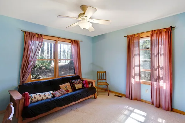 a bedroom with furniture and a window