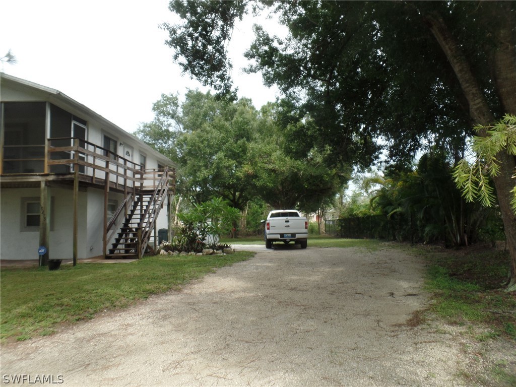 18275 Useppa Road Fort Myers, FL 33967 - Photo 2 of 8 a view of a house with backyard and sitting area