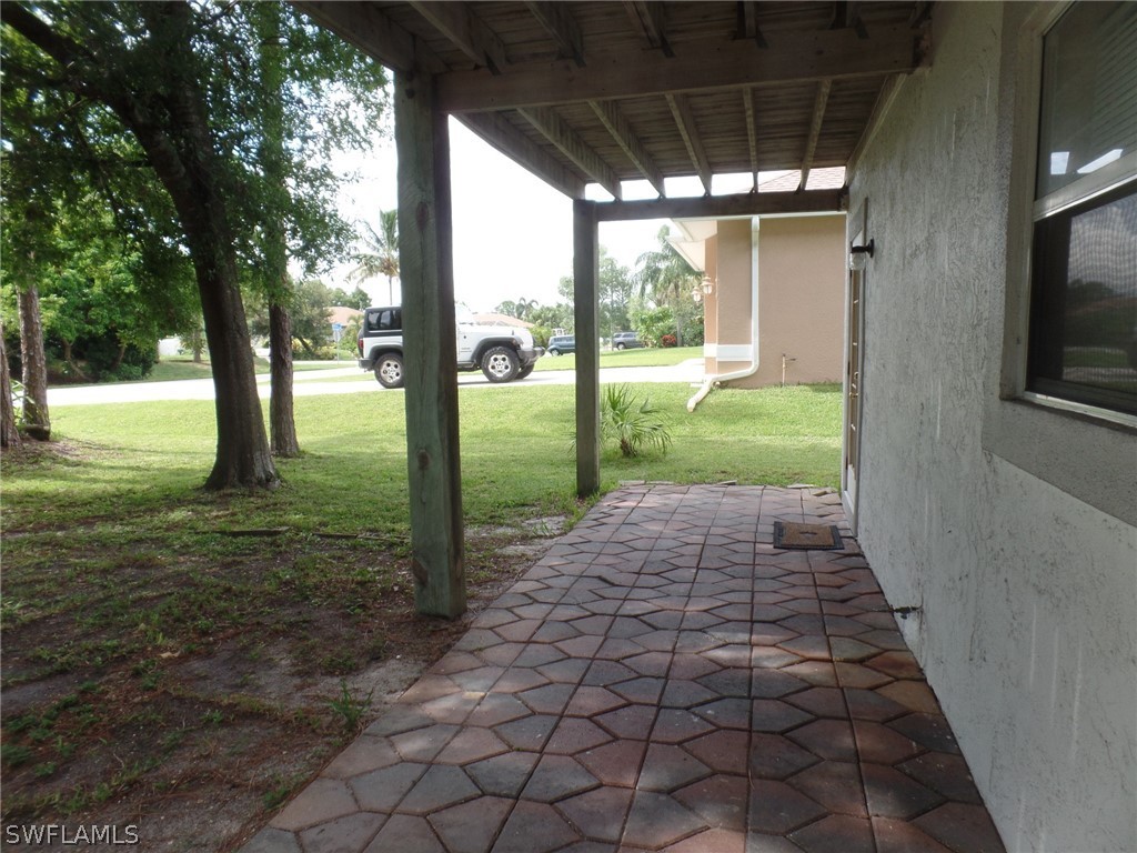 18275 Useppa Road Fort Myers, FL 33967 - Photo 4 of 8 a view of a porch with a backyard