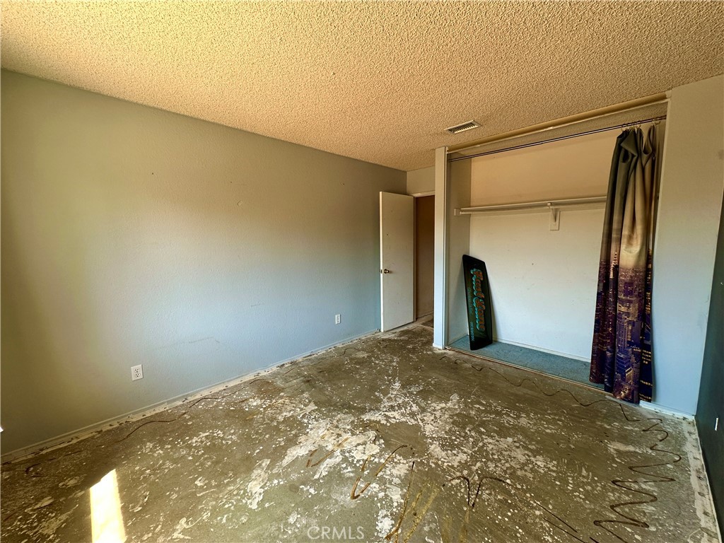 29784 Berea Road Menifee, CA 92584 - Photo 20 of 24 a view of a big room with closet and wooden door