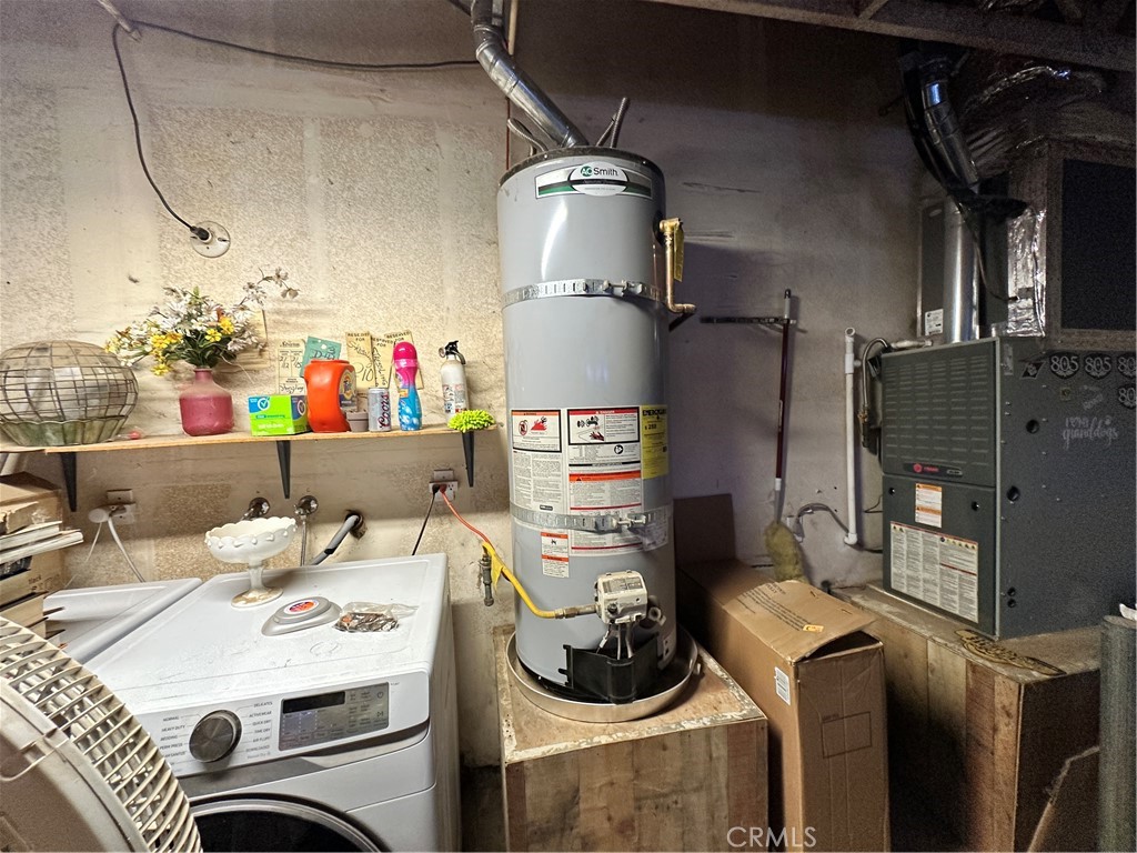 29784 Berea Road Menifee, CA 92584 - Photo 21 of 24 a utility room with dryer washer and other items