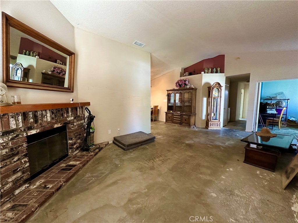 29784 Berea Road Menifee, CA 92584 - Photo 7 of 24 a view of a livingroom with furniture and a flat screen tv
