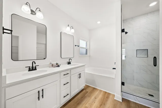 a bathroom with a bathtub and a shower