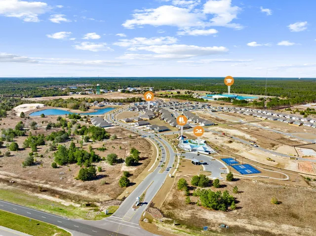 an aerial view of residential houses with outdoor space