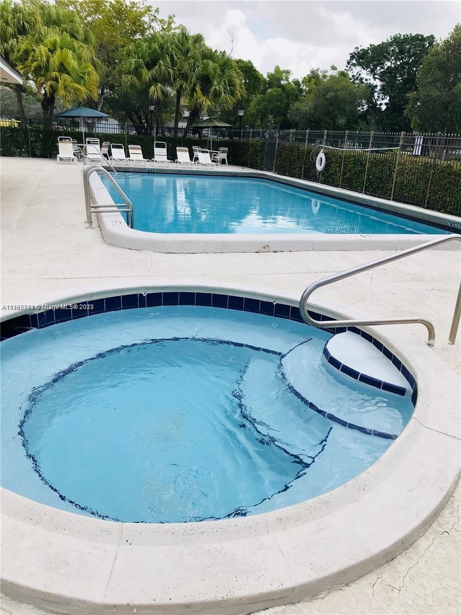 8330 Sands Point Boulevard, Unit N306 Tamarac, FL 33321 - Photo 19 of 20 a view of a swimming pool with a sink