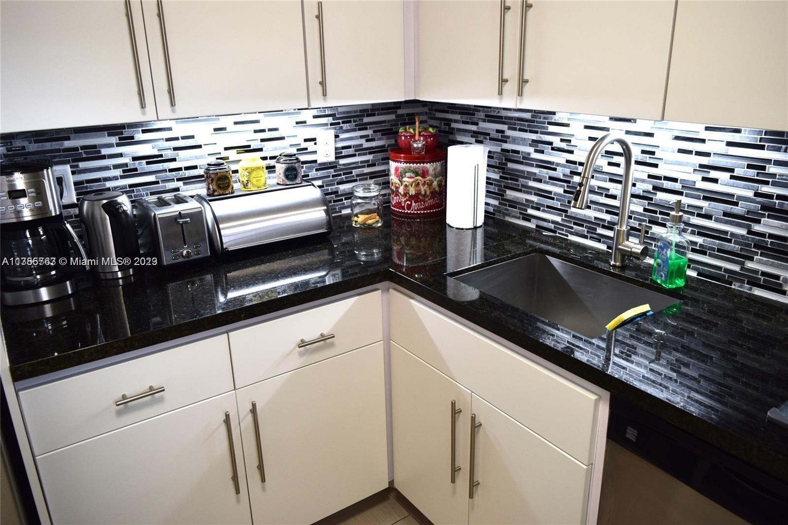 8330 Sands Point Boulevard, Unit N306 Tamarac, FL 33321 - Photo 7 of 20 a close view of kitchen counter space with stove top oven