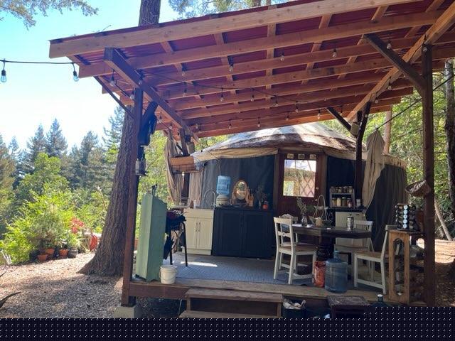 7227 Fern Flat Road Aptos, CA 95003 - Photo 2 of 8 a view of a porch with furniture and a yard