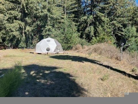 7227 Fern Flat Road Aptos, CA 95003 - Photo 7 of 8 a view of a dry yard with wooden fence