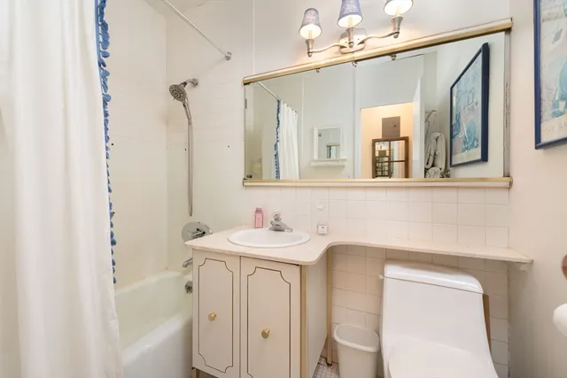 a bathroom with a sink a vanity and a mirror