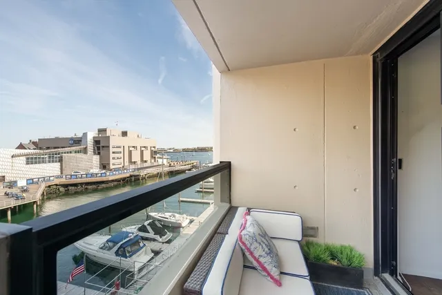 a view of a balcony with chairs
