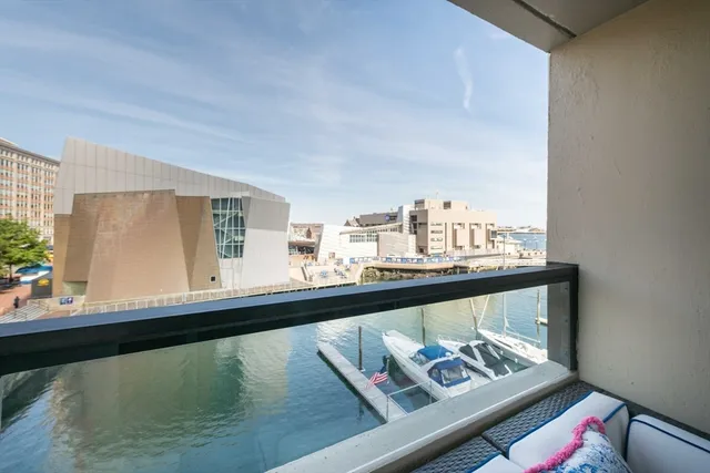 a view of a living room with furniture and wooden floor