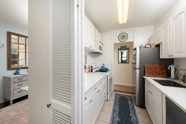 a kitchen with cabinets and window