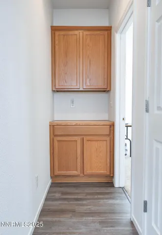 a view of front door with wooden floor