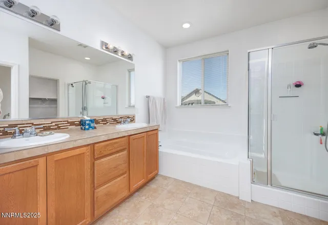a bathroom with a tub a sink and mirror