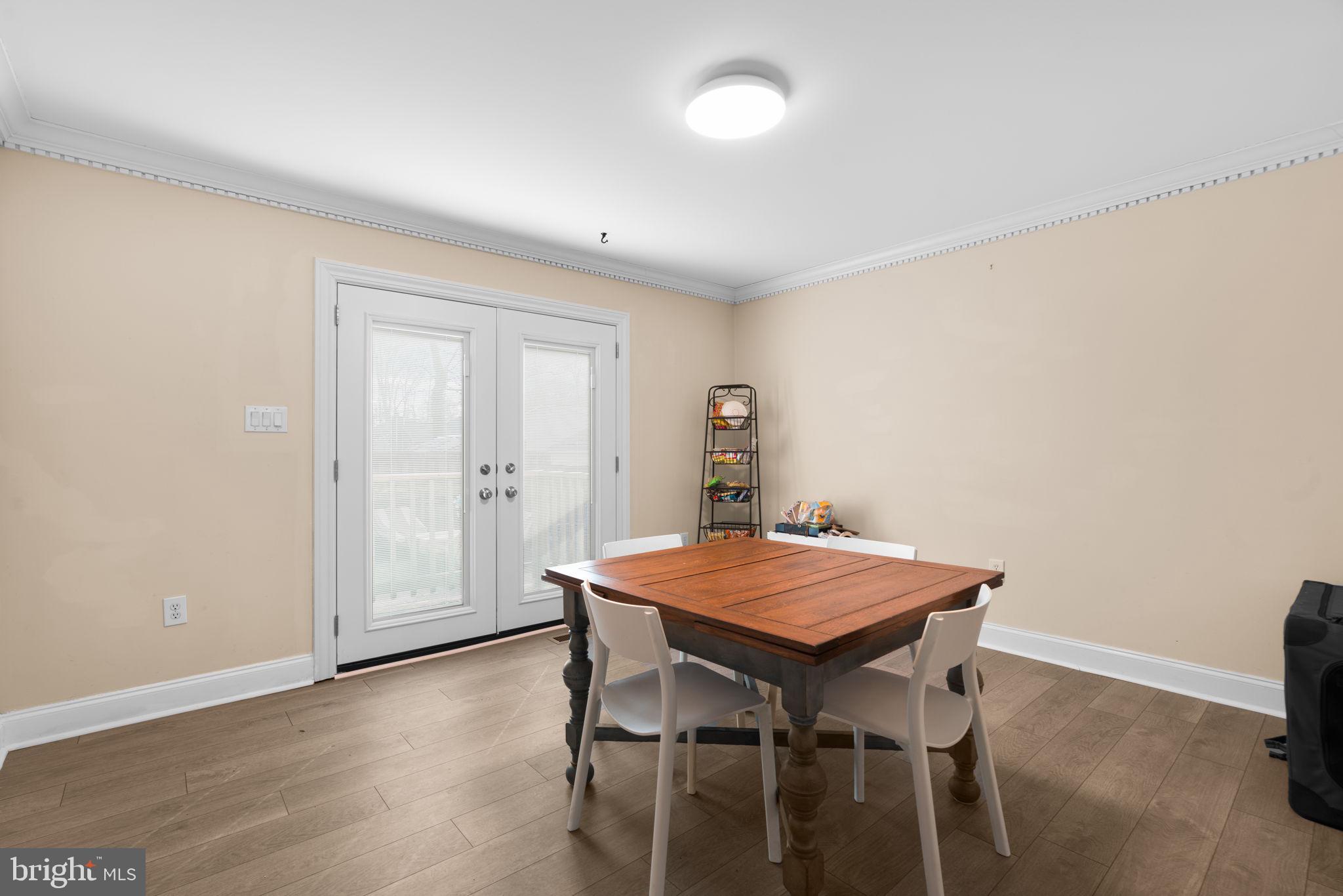 791 Central Avenue East Edgewater, MD 21037 - Photo 11 of 54 a view of a dining room with furniture and wooden floor