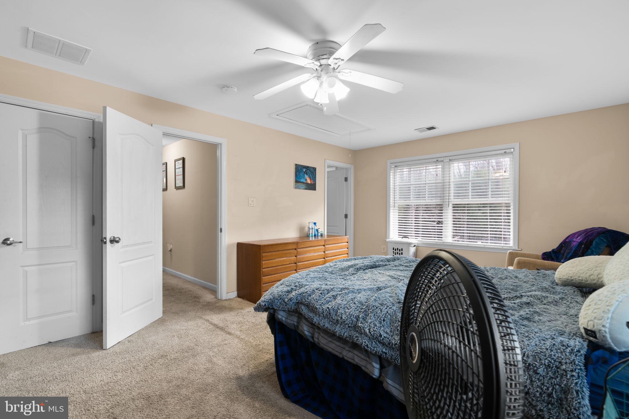 791 Central Avenue East Edgewater, MD 21037 - Photo 30 of 54 a bed sitting in a room next to a window