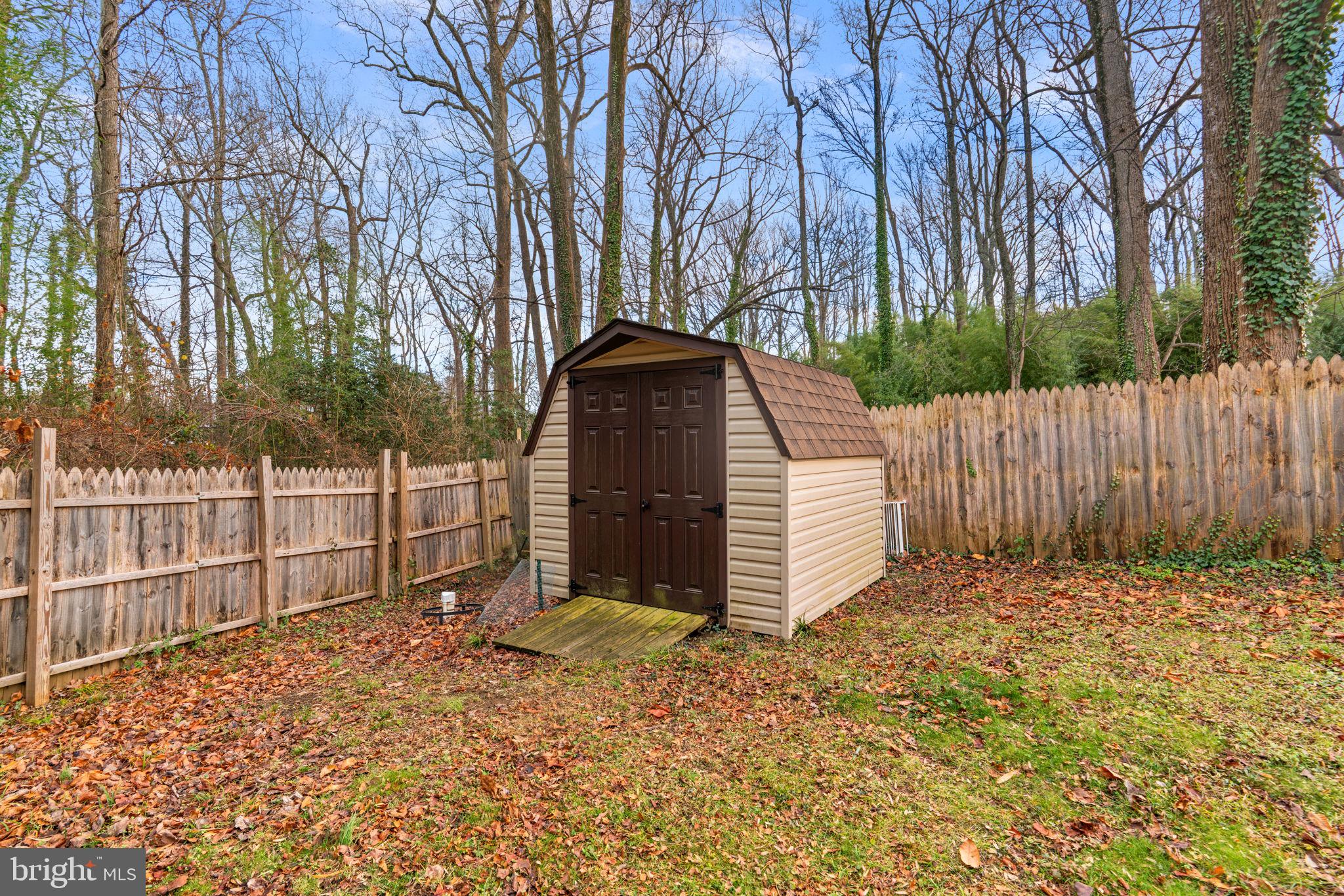 791 Central Avenue East Edgewater, MD 21037 - Photo 40 of 54 a front view of a house with a fence