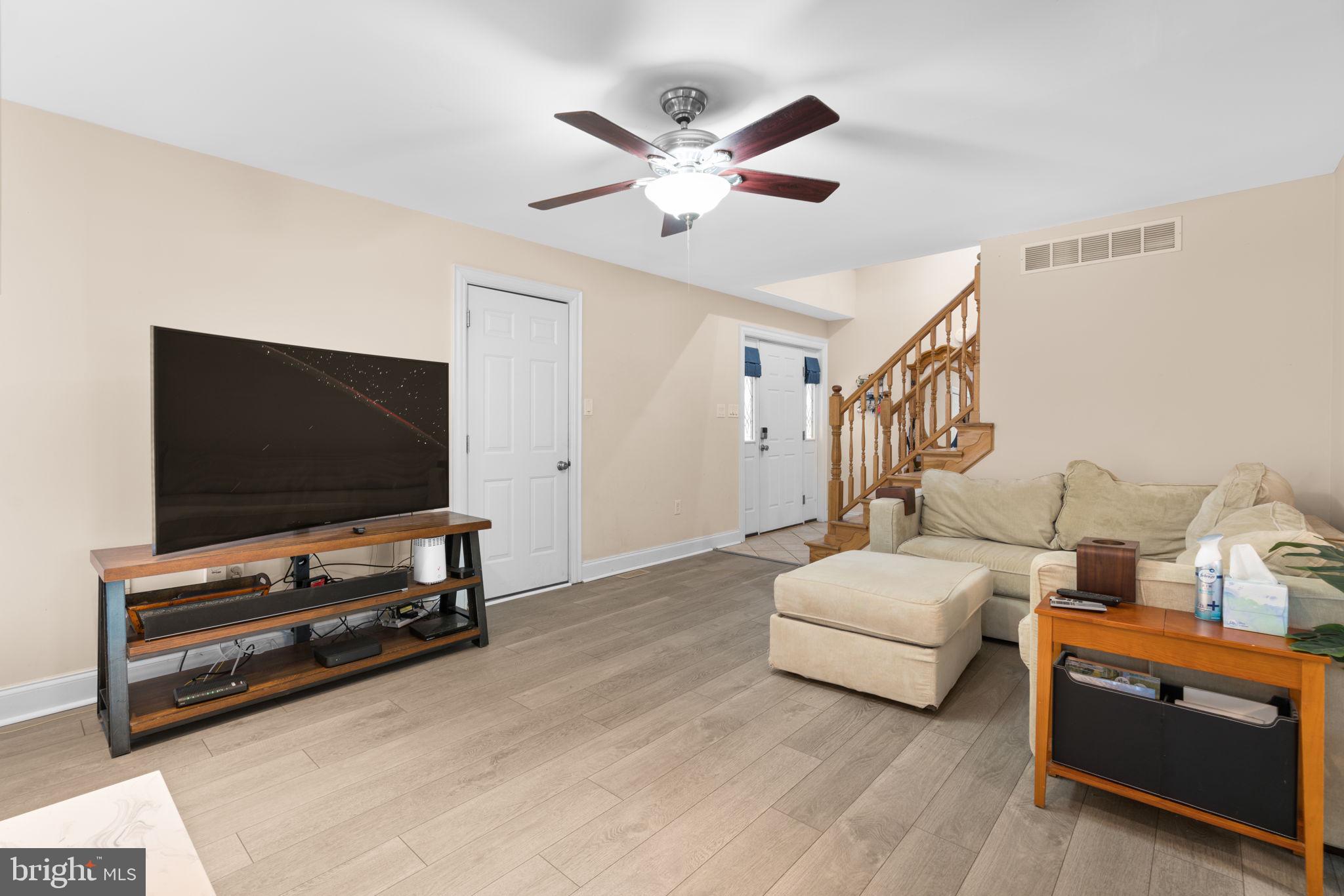 791 Central Avenue East Edgewater, MD 21037 - Photo 9 of 54 a living room with furniture and a flat screen tv