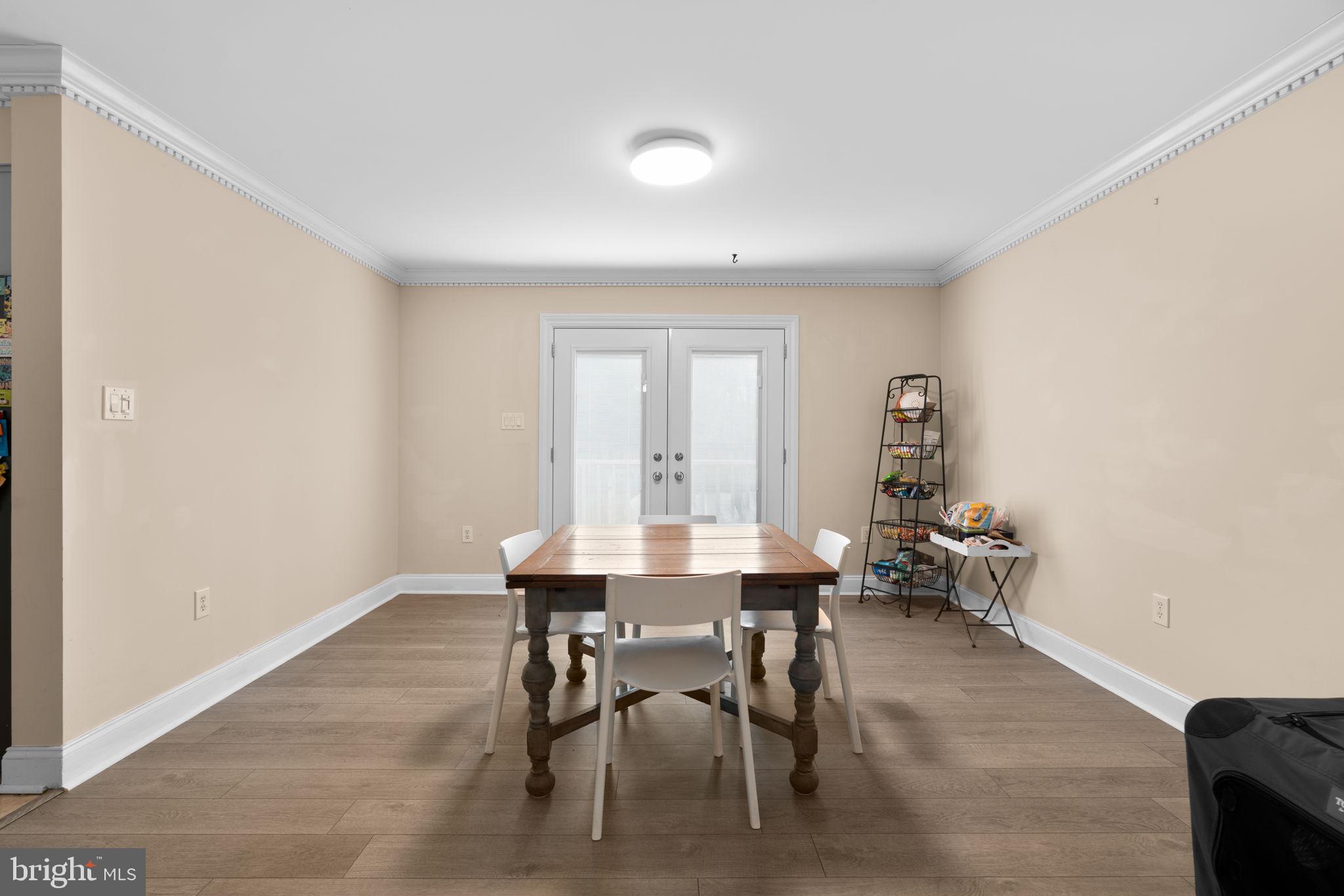 791 Central Avenue East Edgewater, MD 21037 - Photo 10 of 54 a dining room with furniture and window