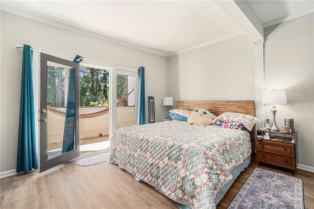 3813 Paces Ferry West Atlanta, GA 30339 - Photo 11 of 22 a bedroom with a bed and a large window