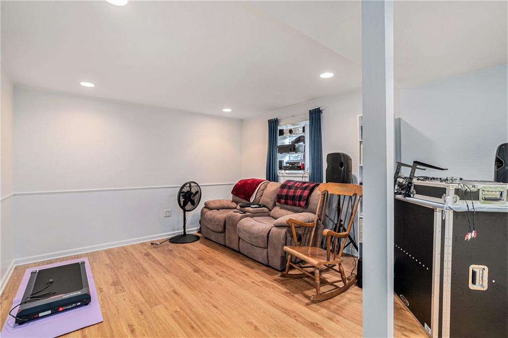3813 Paces Ferry West Atlanta, GA 30339 - Photo 16 of 22 a bedroom with furniture and a wooden floor