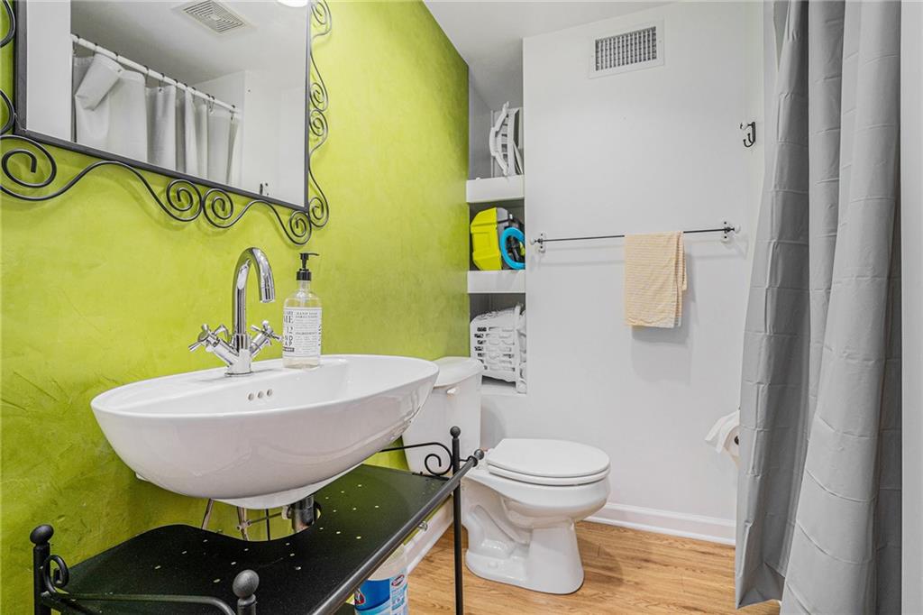 3813 Paces Ferry West Atlanta, GA 30339 - Photo 17 of 22 a bathroom with a sink toilet and mirror