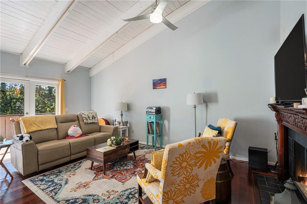 3813 Paces Ferry West Atlanta, GA 30339 - Photo 5 of 22 a living room with furniture a flat screen tv and a fireplace