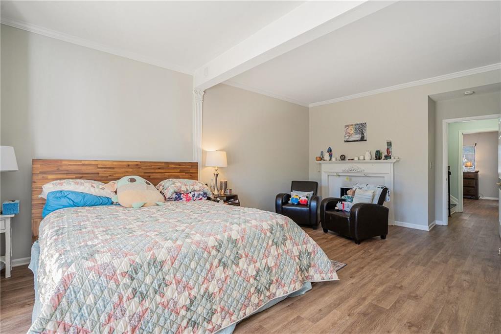 3813 Paces Ferry West Atlanta, GA 30339 - Photo 10 of 22 a bedroom with double bed and a couch