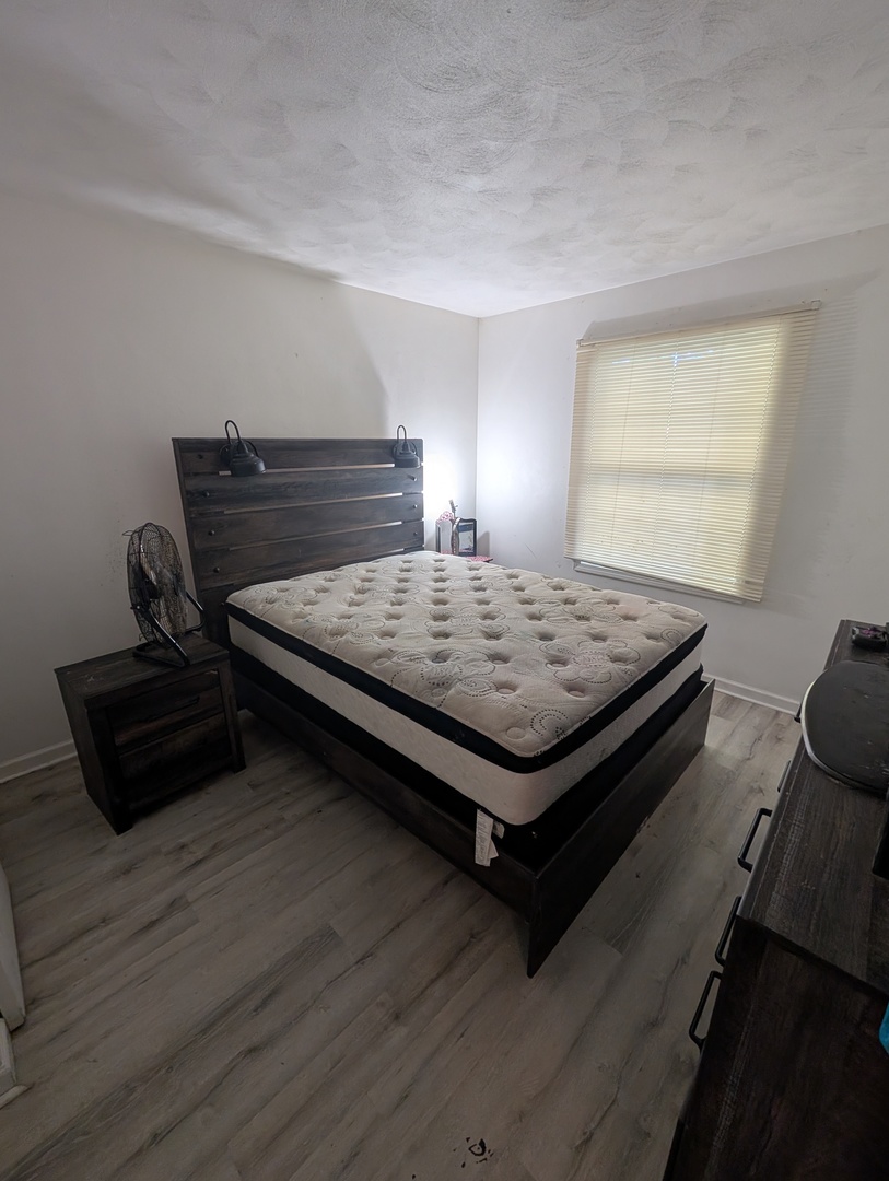 6232-6234 Appomattox Road Davenport, IA 52806 - Photo 9 of 21 a bed sitting in a bedroom next to a window