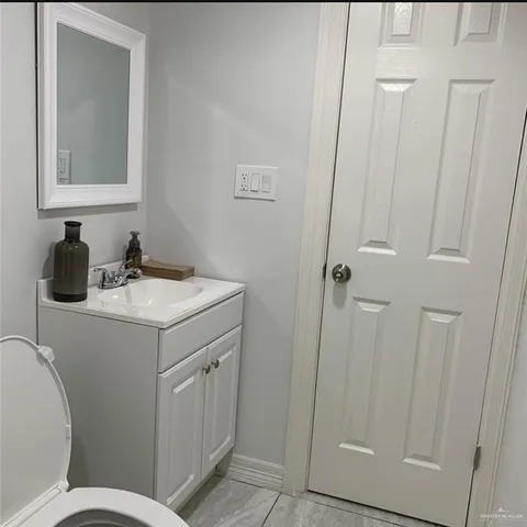 a bathroom with a sink toilet and vanity
