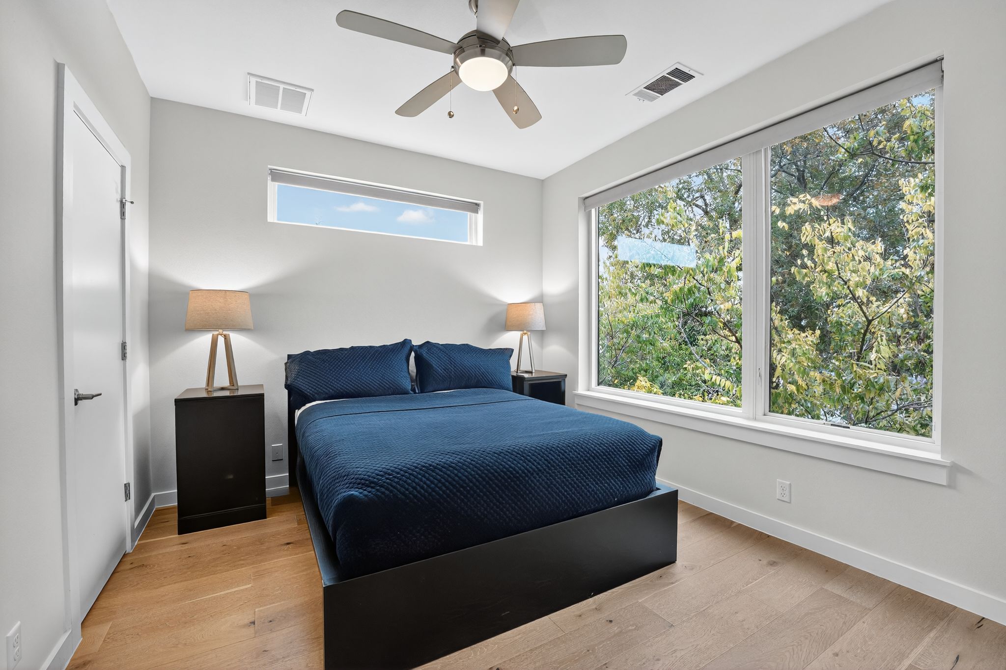 2301 Bluebonnet Lane, Unit 5 Austin, TX 78704 - Photo 20 of 26 Bedroom with light wood-type flooring and a ceiling fan