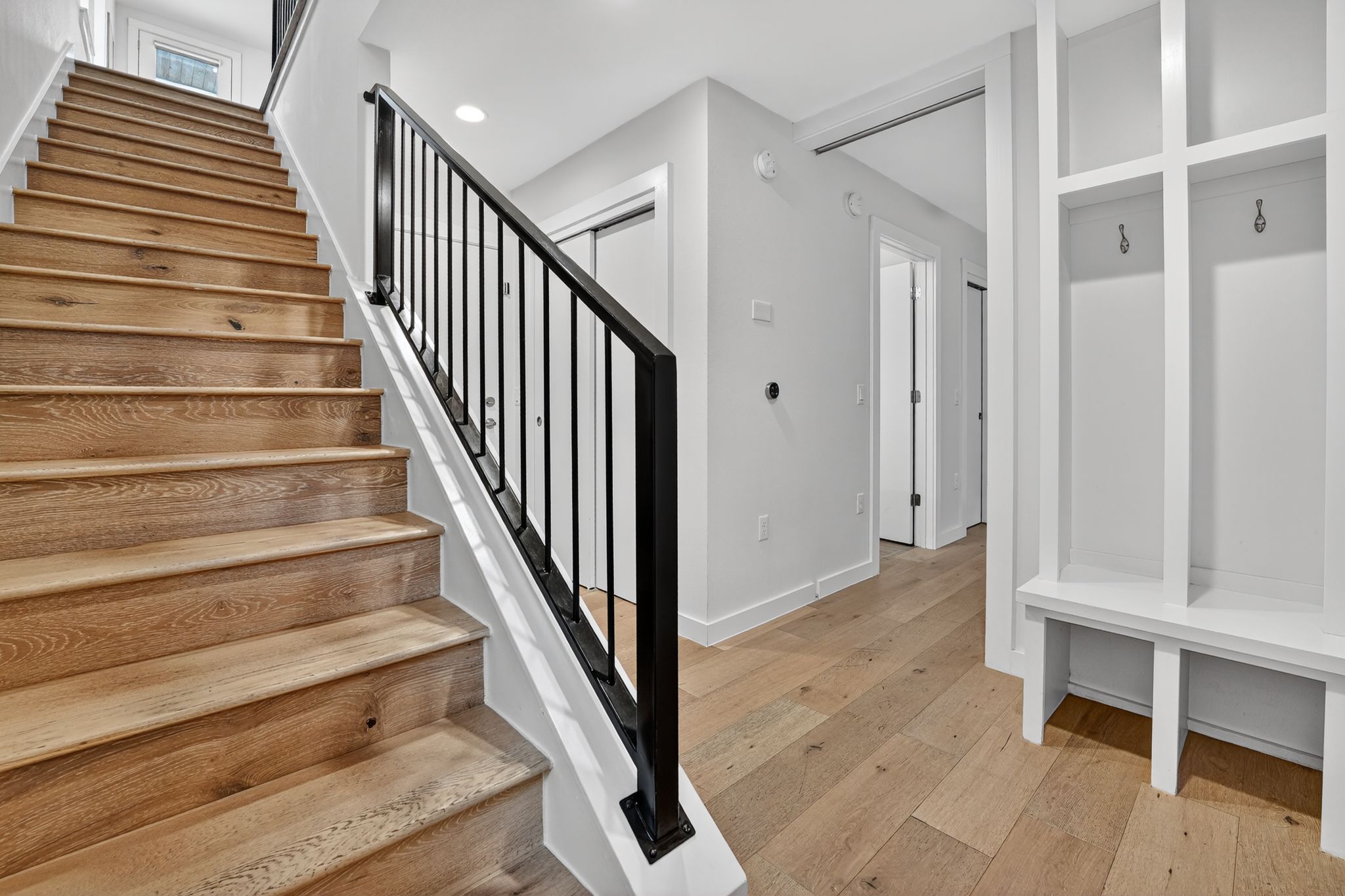 2301 Bluebonnet Lane, Unit 5 Austin, TX 78704 - Photo 9 of 26 Stairway with hardwood / wood-style floors and recessed lighting