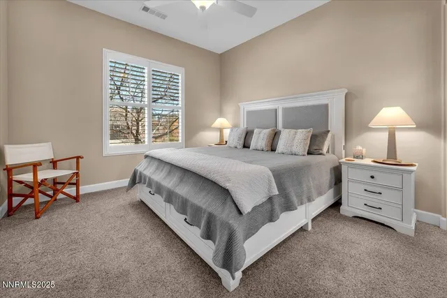 a view of a patio with table and chairs potted plants