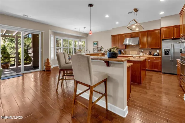 a kitchen with lots of counter top space and stainless steel appliances