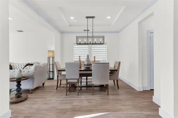 a living room with furniture and a lamp