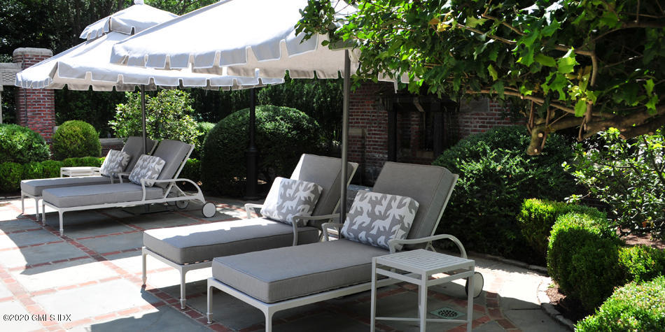 460 North Street Greenwich, CT 06830 - Photo 11 of 25 a couple of chairs sitting in a backyard of a house