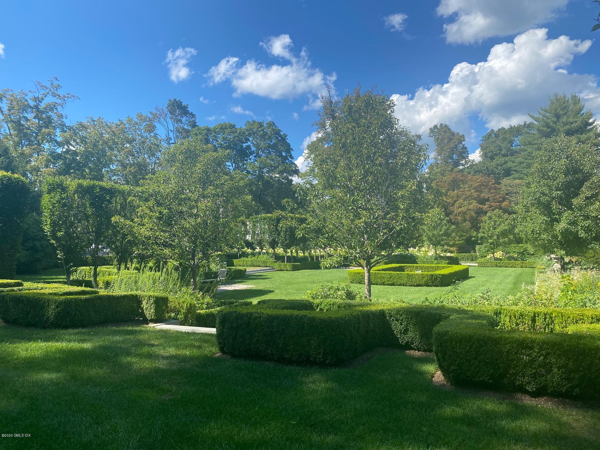 460 North Street Greenwich, CT 06830 - Photo 14 of 25 a view of a golf course with a lake