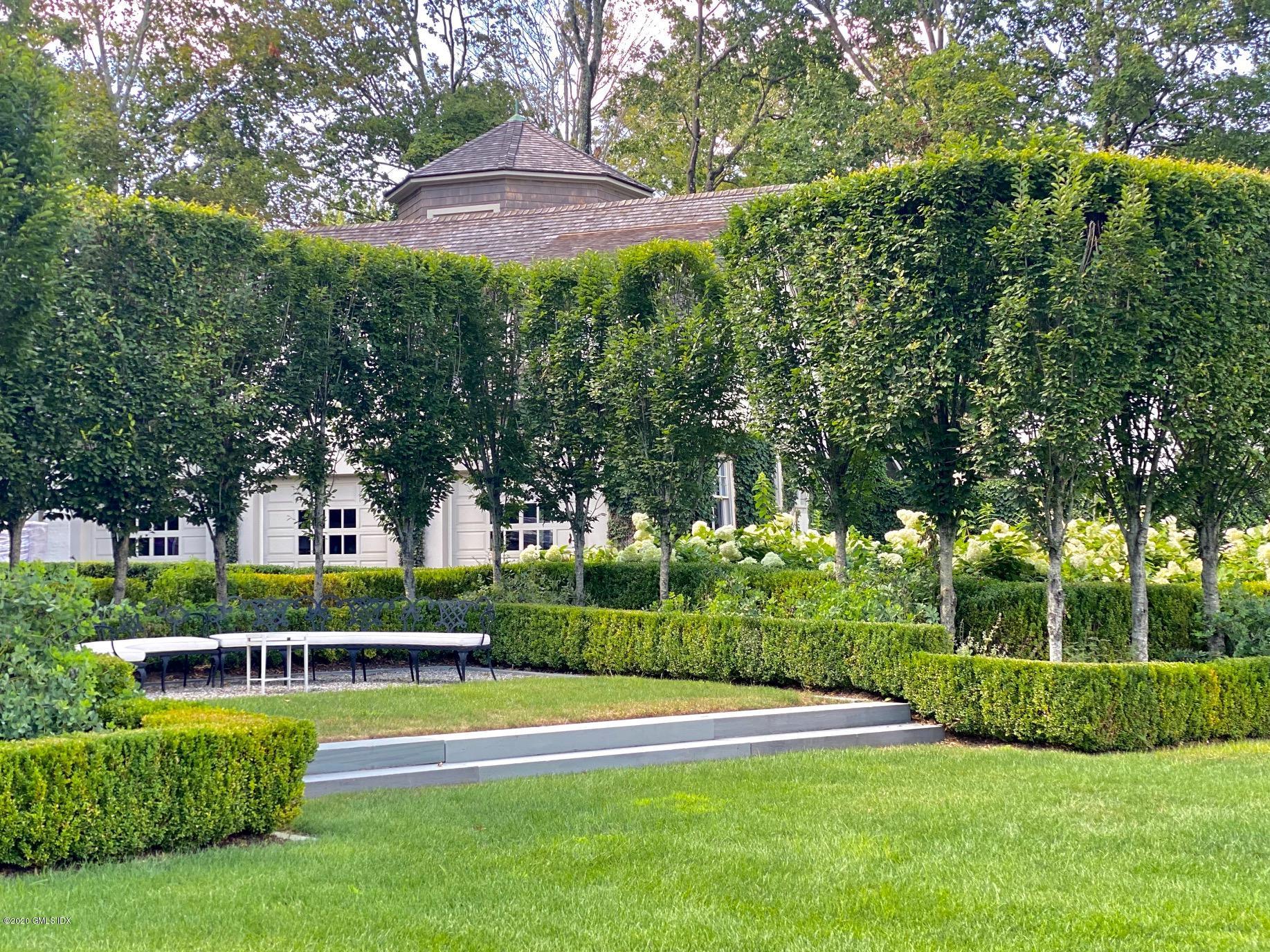 460 North Street Greenwich, CT 06830 - Photo 17 of 25 a view of a house with a big yard