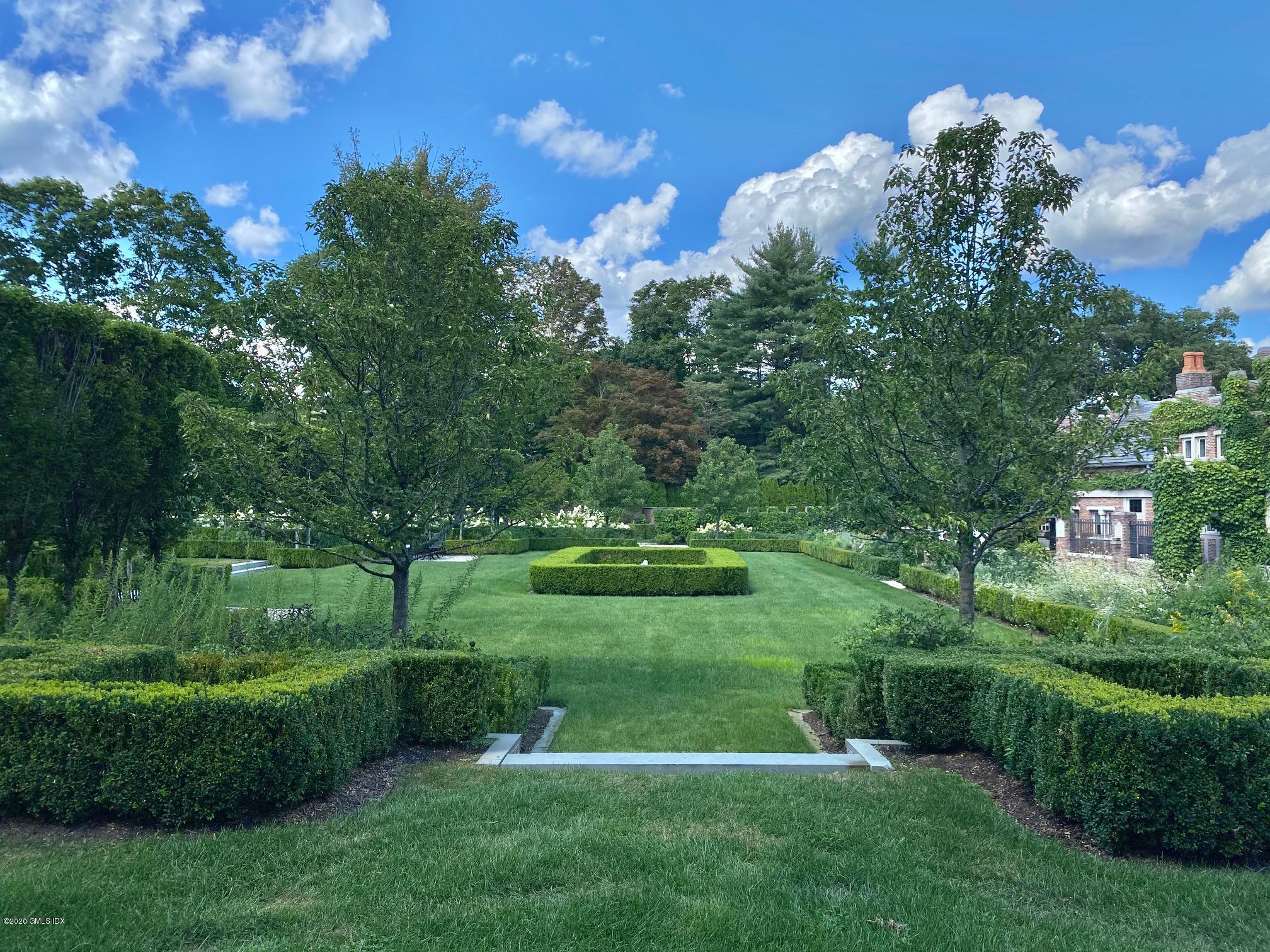 460 North Street Greenwich, CT 06830 - Photo 19 of 25 a view of a golf course with a garden