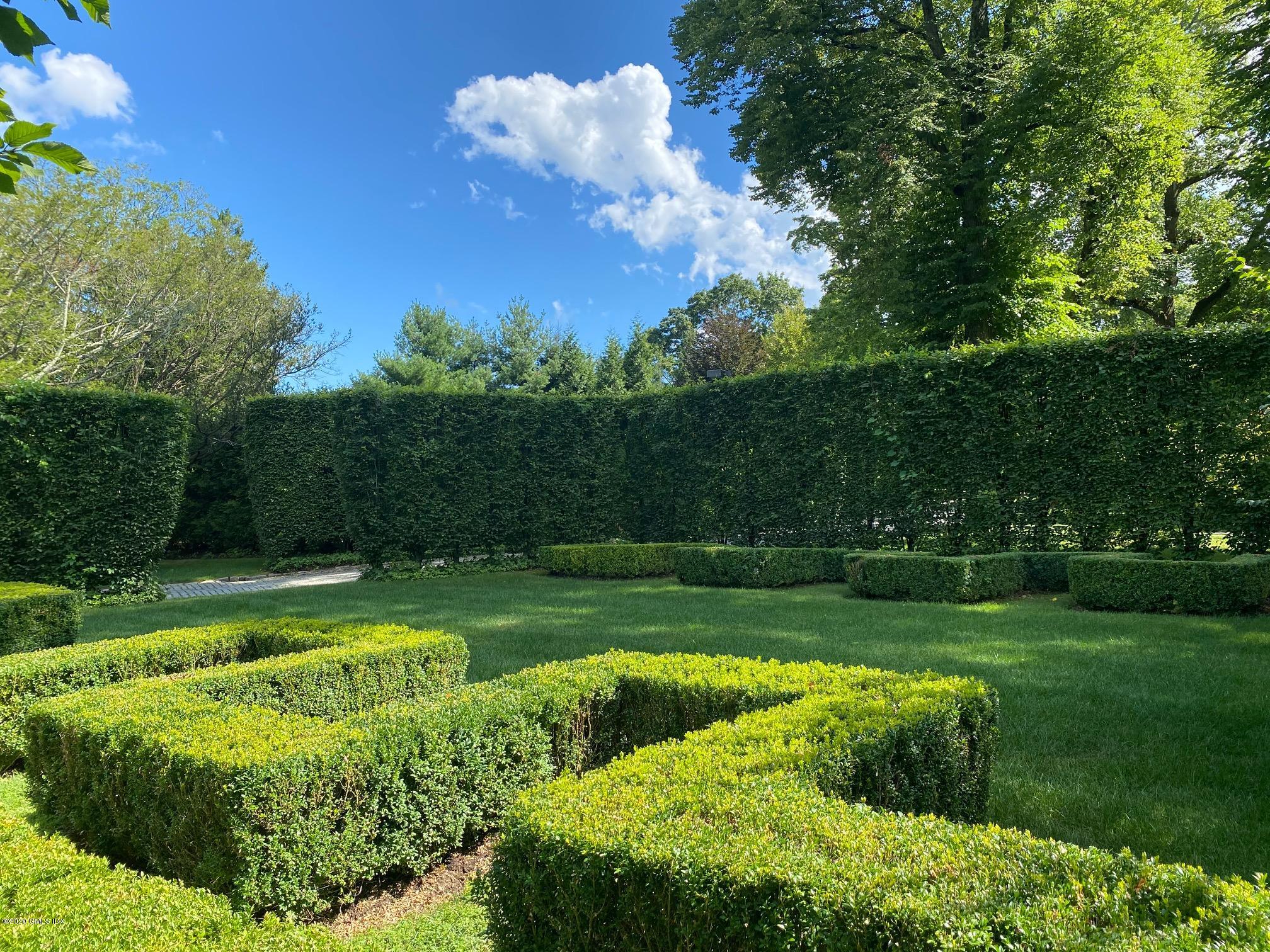460 North Street Greenwich, CT 06830 - Photo 20 of 25 a view of a golf course with a garden