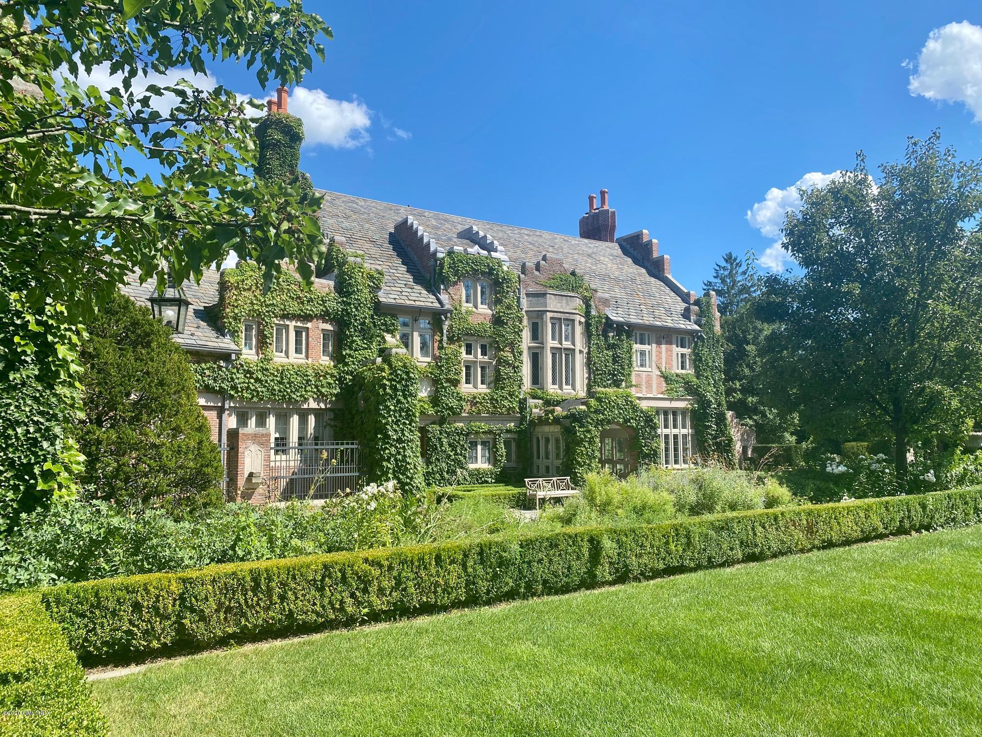 460 North Street Greenwich, CT 06830 - Photo 2 of 25 a front view of a house with a yard