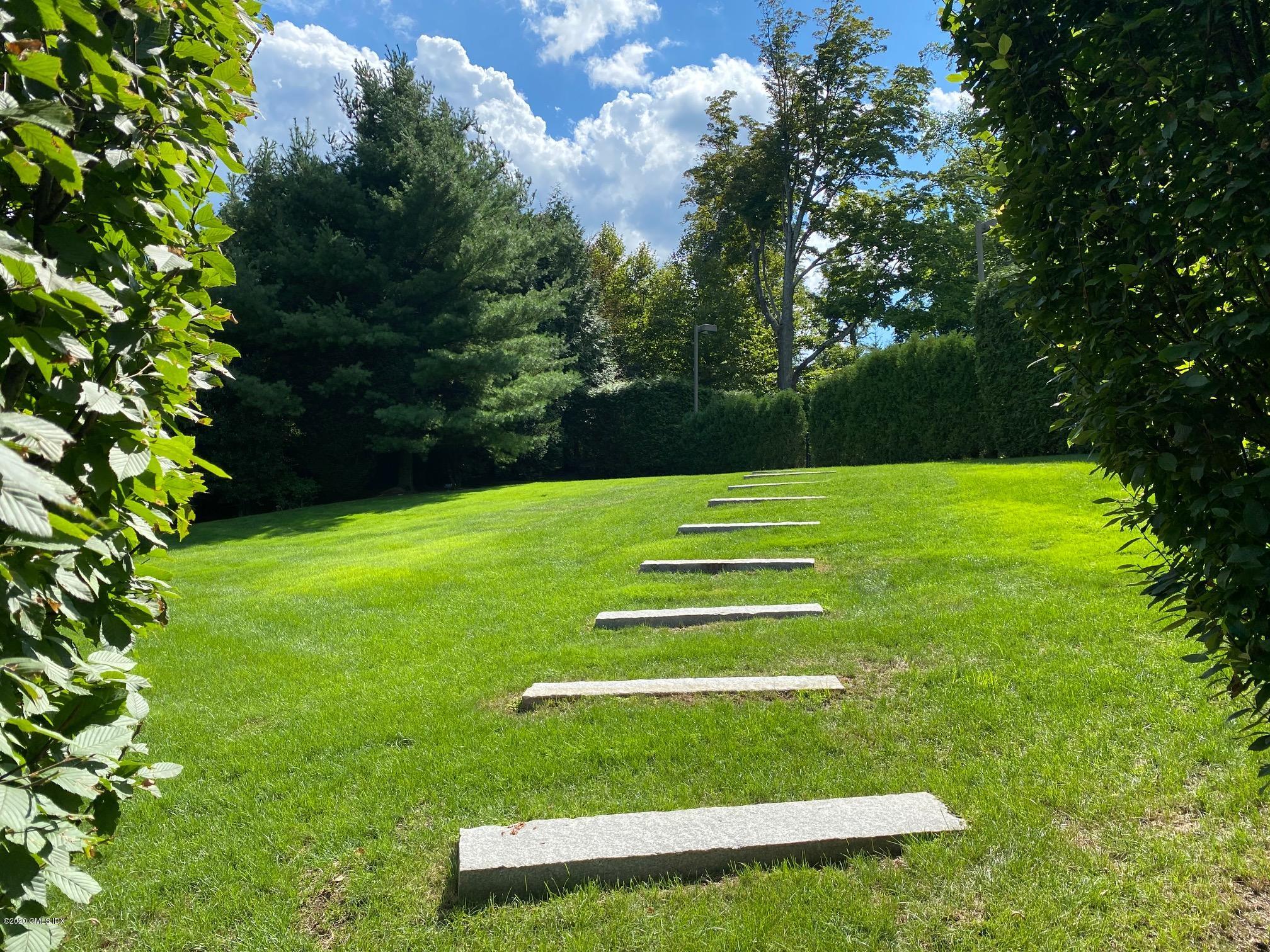 460 North Street Greenwich, CT 06830 - Photo 21 of 25 a view of a field with a tree