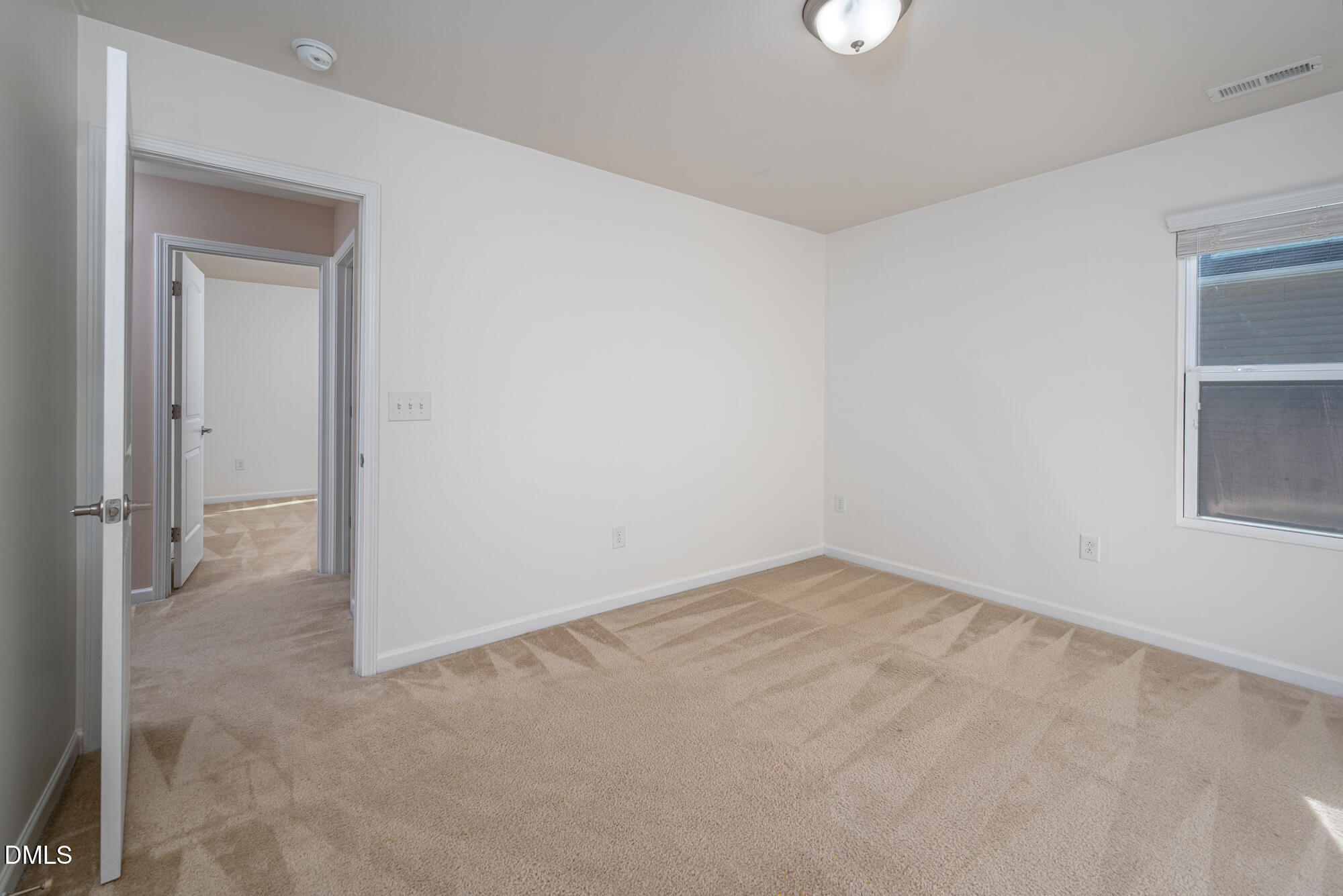 3548 Althorp Drive Raleigh, NC 27616 - Photo 35 of 56 an empty room with windows