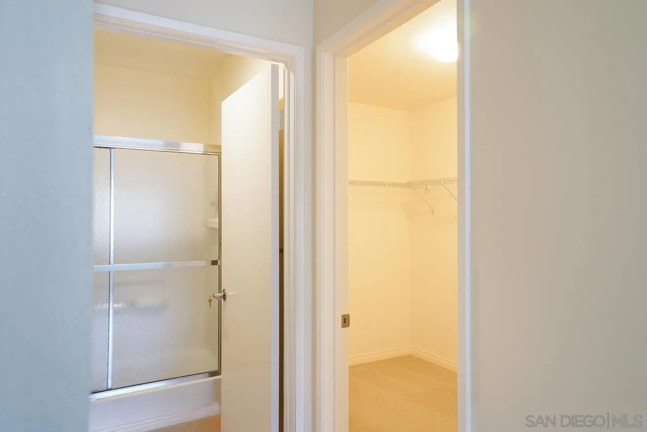 17161 Alva Road, Unit 3125 San Diego, CA 92127 - Photo 12 of 29 a bathroom with a glass shower door