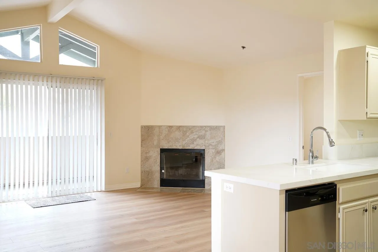 17161 Alva Road, Unit 3125 San Diego, CA 92127 - Photo 22 of 29 a view of a kitchen with a sink and a fireplace
